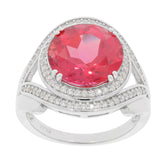Round pink sapphire ring in sterling silver with sparkling accents for elegant styling.